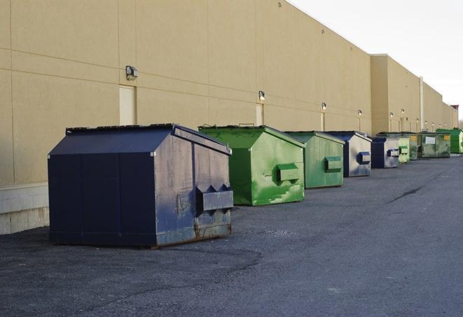 an overflowing dumpster filled with roofing shingles and other scraps from a construction project in Hesston, PA